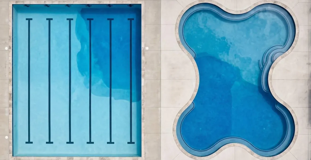 Aerial view comparing rectangular lap pool with clear lane markings versus curved leisure pool design