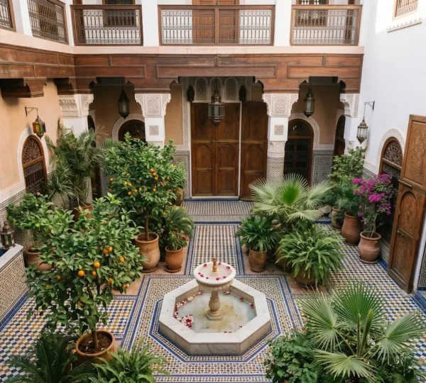 Authentic Moroccan riad courtyard with traditional zellige tiles and natural light creating cultural atmosphere